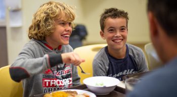 Boys eating lunch at the dining hall