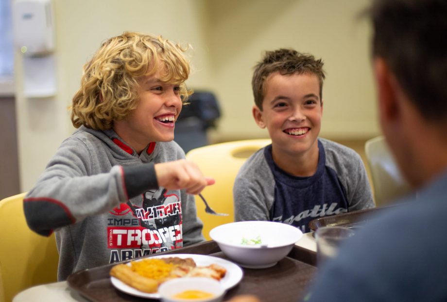 Boys eating lunch at the dining hall