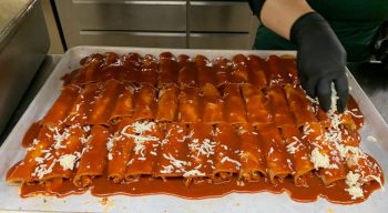 Topping enchiladas with mozzarella cheese