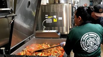 Fabi and Jose putting on the finishing touch on the Sirloin Steak Beef Fajitas