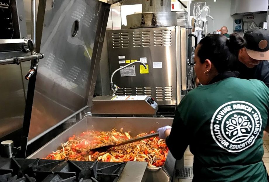 Fabi and Jose putting on the finishing touch on the Sirloin Steak Beef Fajitas