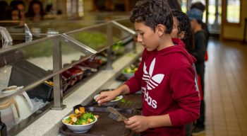 Boys serving lunch at the dining hall