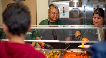 Serving lunch to campers at the dining hall