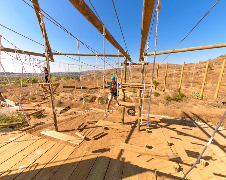 Woman on the ropes course at Adventure Hill