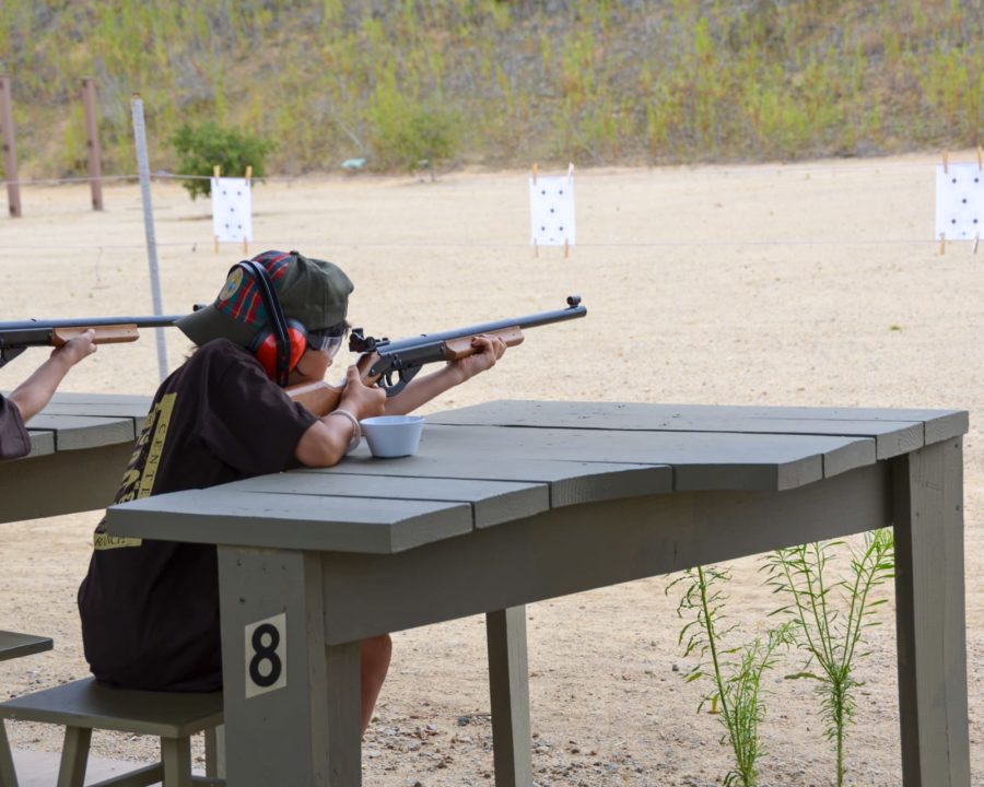 Boy practicing his aim at BB guns