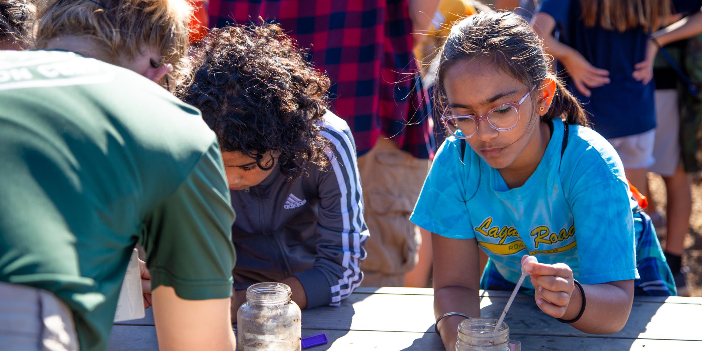 Male and female preteens at science