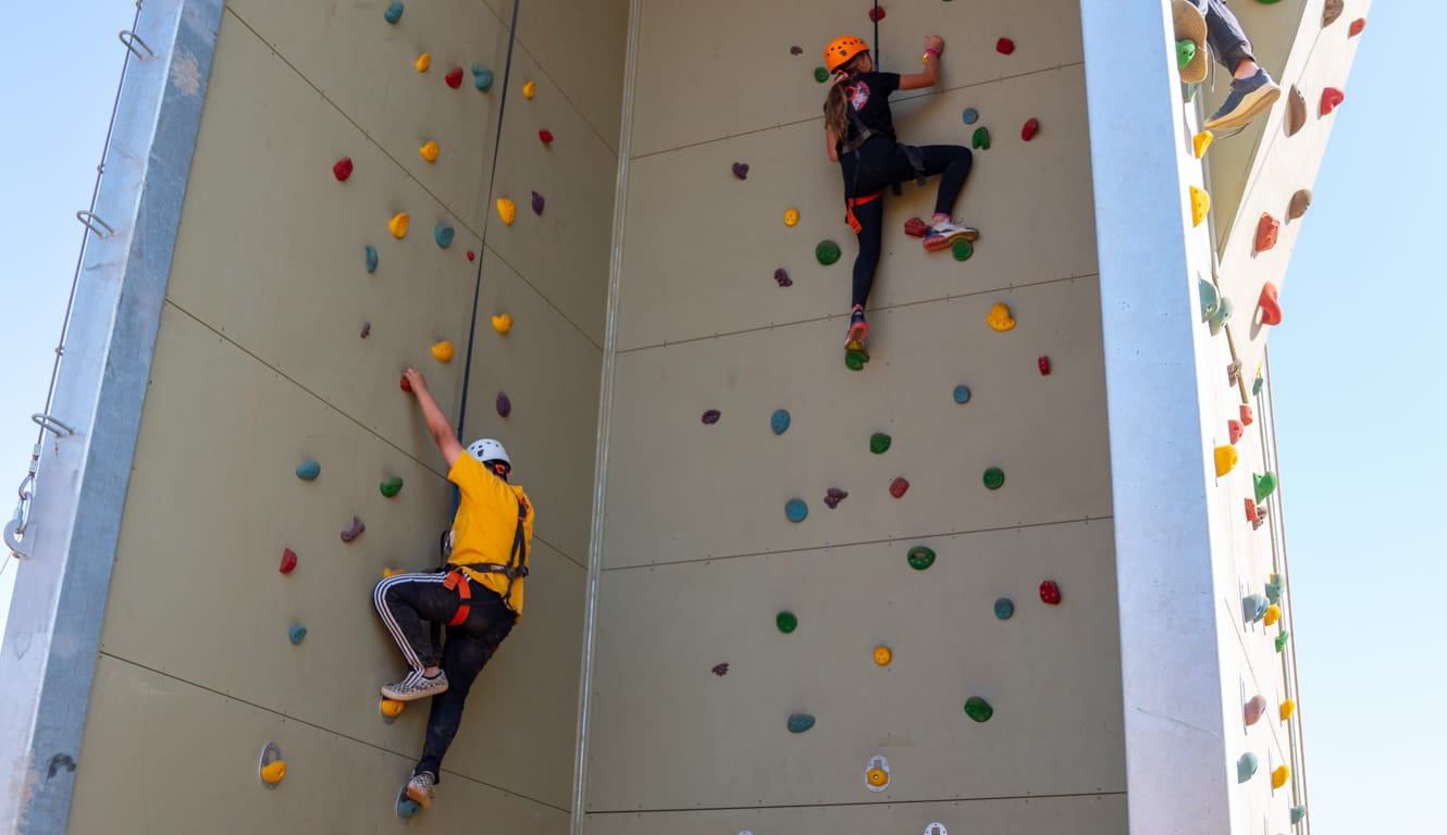 Kids going up the climbing tower