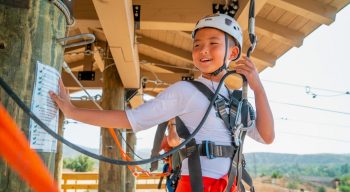 Boy getting ready to zip line